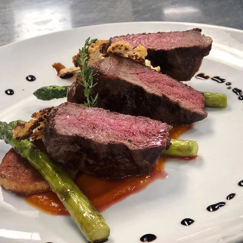 Prairie Canary Restaurant and Bar signature dishes  Menu changes seasonally; expect creative preparations of regional meats like pork and beef, fresh salads, and dishes highlighting local vegetables.